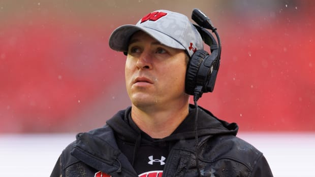 Wisconsin head coach Jim Leonhard looking up at the jumbotron against Maryland.